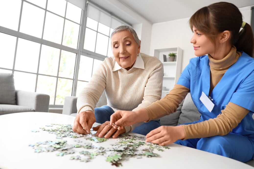 Staff supporting a senior in a NJ dementia day program
